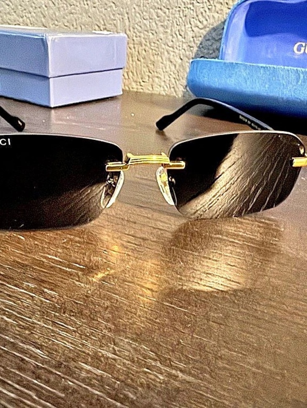 Gucci GG1221S Square Rimless Sunglasses Black & Gold
